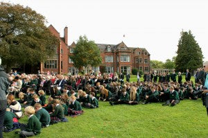 School pupils sitting outside